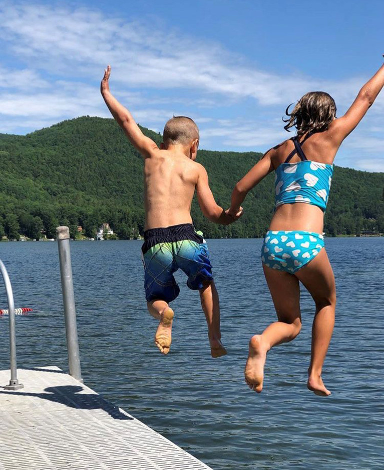kids jumping off dock